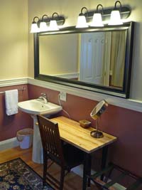 pedestal sink with very large mirror and makeup table